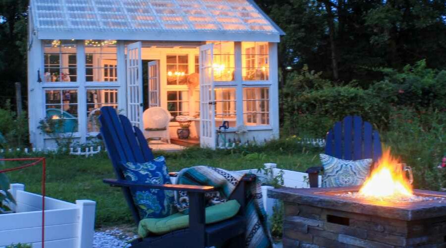 Cute short term rental house with fire pit at dusk.
